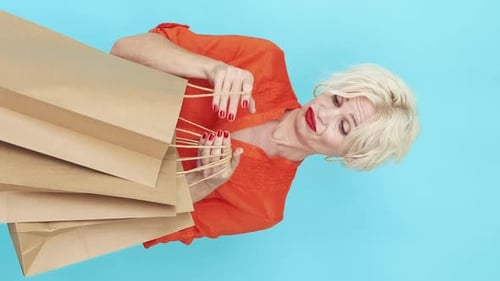 Senior Woman Holding Shopping Bags