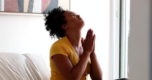 Woman Prays with Hands Together for Hope