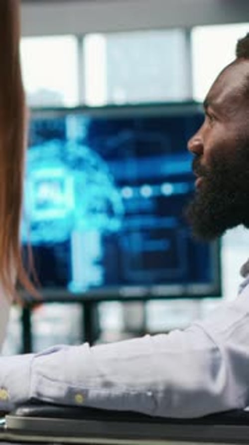 Vertical Video Young Engineer and Coworker with Paraplegia Using AI Doing Brainstorming