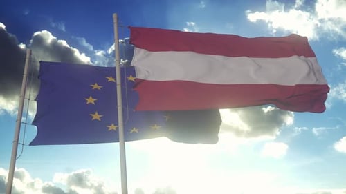European Union and Austrian Flags Waving in Cloudy Sky