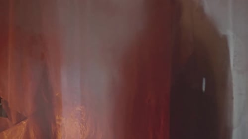 Abstract Light and Hand Behind Rippled Plastic