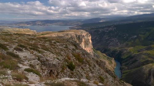 Overcast Canyon Boasts Rugged Cliffs Cloudcovered Overlook Reveals Striking Geological Formations
