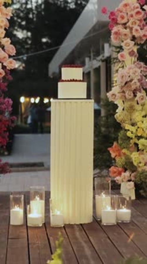 Wedding Cake Display with Flowers and Candles
