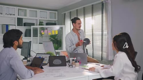 Group of young businessman and businesswoman working in the office.