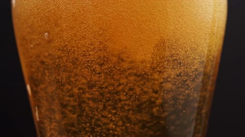 Close Up of Beer Pouring into a Glass