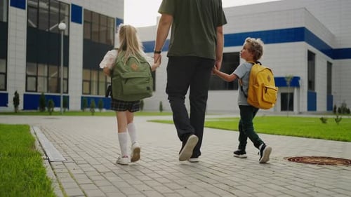 Children Go To School Kids Holding Dad Hands And Walking In Schoolyard Rear View School Children