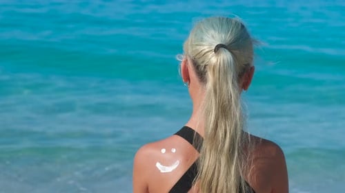 Teen Apply Sunblock During Summer Vacation