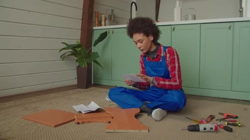 Woman Assembling Furniture Indoors
