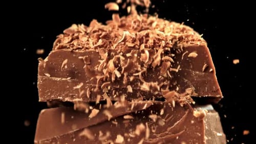 The Grated Chocolate Falls on the Chocolate Slices Filmed on a Highspeed Camera at 1000 Fps