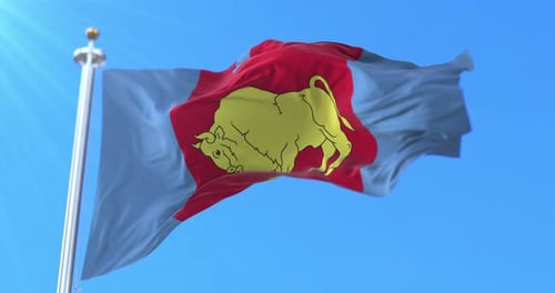 Golden Bull Flag Waving Against Blue Sky