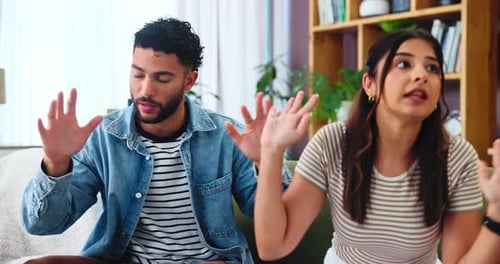 Couple Arguing on Couch in Home Living Room
