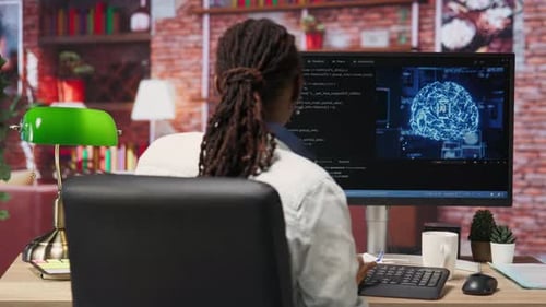 Admin Writing Artificial Intelligence Code on Computer
