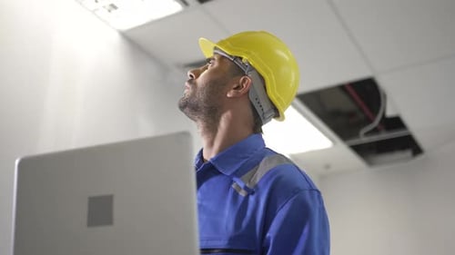Engineer is working at tower.
