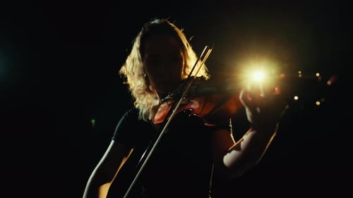 Violinist Plays Darkly Lit Dramatic Solo