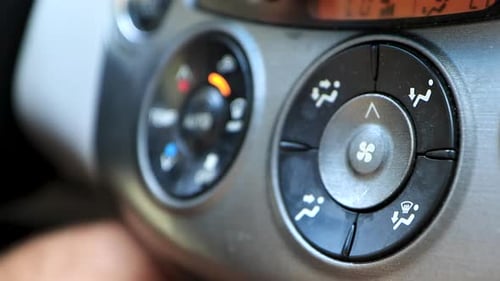Hovering shot of air control buttons in a car