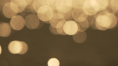 Warm Golden Bokeh Light Sparkle Seamless Loop Background