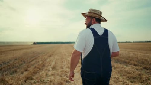 Happy Farmer in Agricultural Fields Back View Following Shot Rural Lifestyle Middle Aged Man Walking