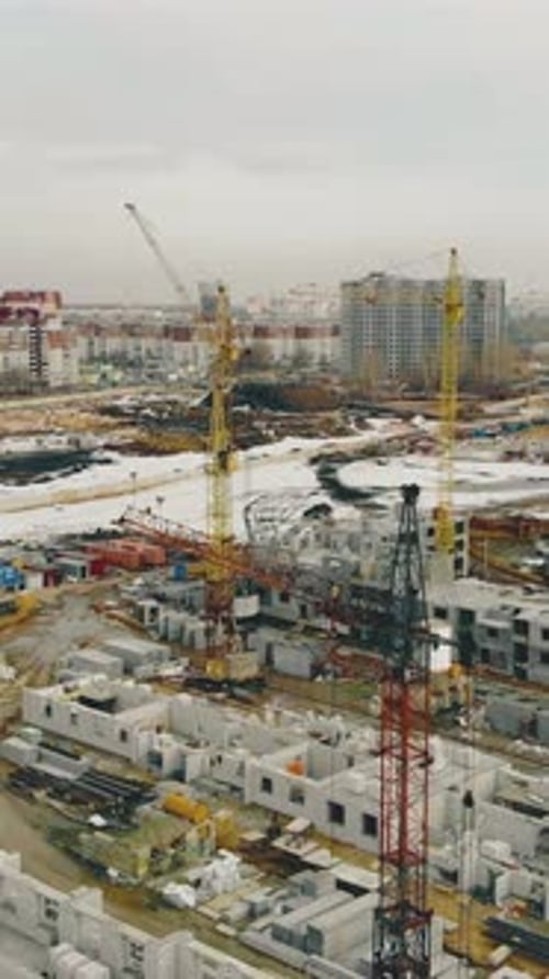 Construction Site with Buildings Yellow Cranes on Weekend