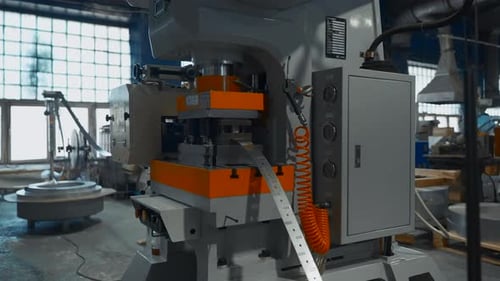 Machines with hole punch for metal line. Creative. Long metal line on industrial machines. Workshop