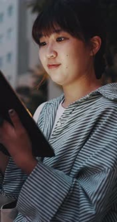 Tablet, smile and businesswoman in city at night with research for creative project online