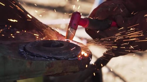 Cutting a circular Piece of Metal with a Cutting Blow Torch - Slowmo