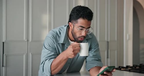 Scroll, phone and man in home with coffee for social media post, online search and notification