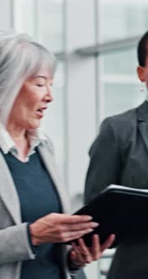 Business women, walking and office with conversation, talking and brainstorming for meeting at work