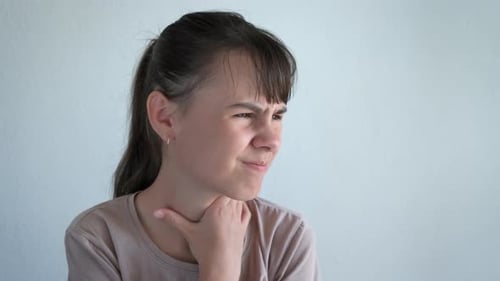 Young Woman with Sore Throat, Clutching Neck