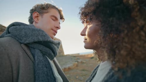 Affectionate Couple Gazing at Each Other by the Sea
