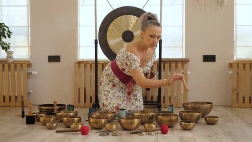 Woman Plays Singing Bowls, Meditation and Sound Therapy