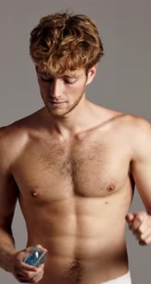 Face, cologne and man in studio, cosmetics and dermatology on gray background