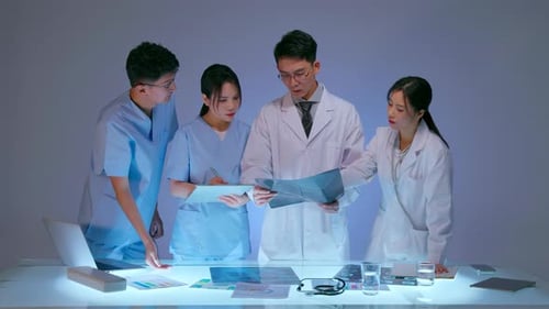 Clinic therapist talking with colleagues about disease. Professional expert doctor talking with medi