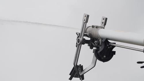 Agricultural Irrigation Pivot Gun Spraying Water on a Field