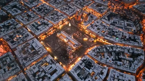 High aerial shot of Krakow Main Square in the winter evening, Poland