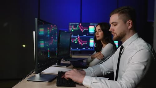 Stock Market Broker Pointing at Live Trading Screen