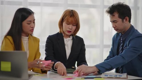 Business Team Collaborates in Office on Project