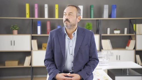 Thoughtful businessman in his office.