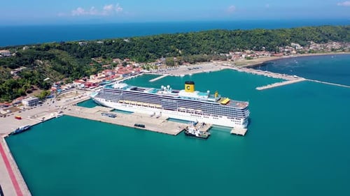 Cruise Ship Docked at Port on Sunny Day