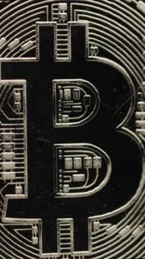Silver Bitcoin Close-up Shows Cryptocurrency Details