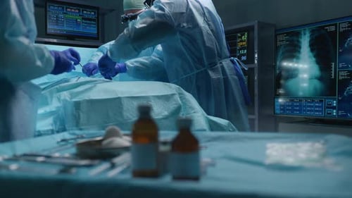 Team of Professional Medical Surgeons Performs the Surgical Operation in a Modern Hospital Doctors