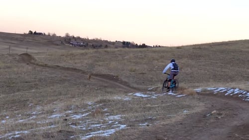 Mountain bikers riding a rural trail