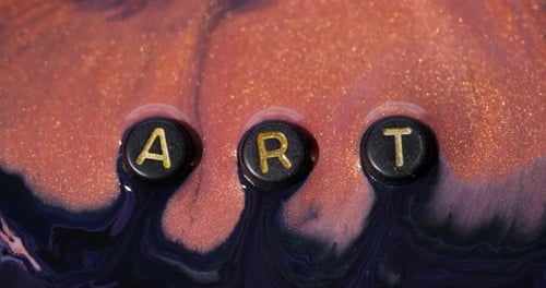 Art Made of Liquids and Floating Letter Buttons