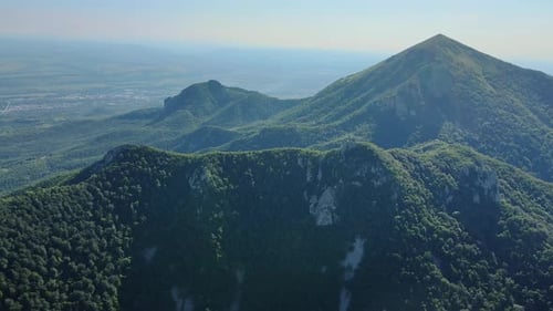 Enjoy an Aweinspiring Sight of a Vibrant Green Mountain Range From a High Vantage Point