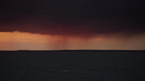 Distant Rain Over a Stormy River View