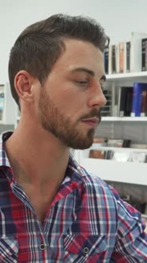 Young Man Looking Off-Camera Indoors