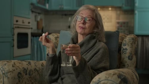 Woman Puts Pill in Water at Home