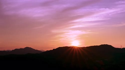 Sunrise landscape on the top of the mountain, with colorful clouds in the sky.