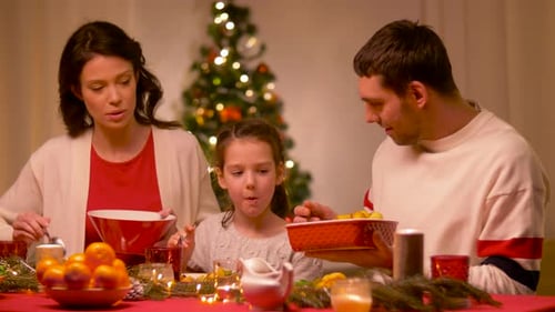 Family eating at table celebrating Christmas