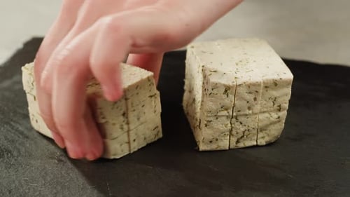 Cutting Herb Seasoned Tofu Block into Slices