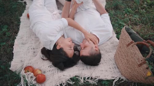 Happy Cute boy with apple In Park. Pretty Child Face.Adorable Carefree Childhood Moment